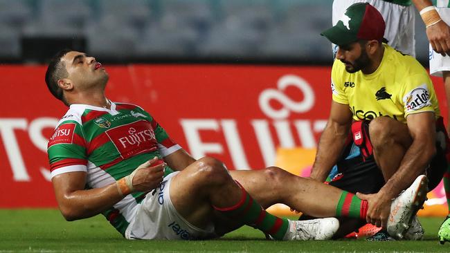 South Sydney's Greg Inglis has his leg attended during a game. Picture: Brett Costello