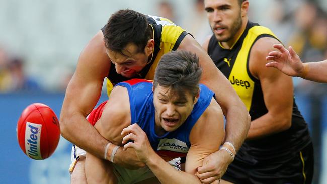 Toby Nankervis lays a tackle on Brisbane’s Stefan Martin. Picture: Getty Images