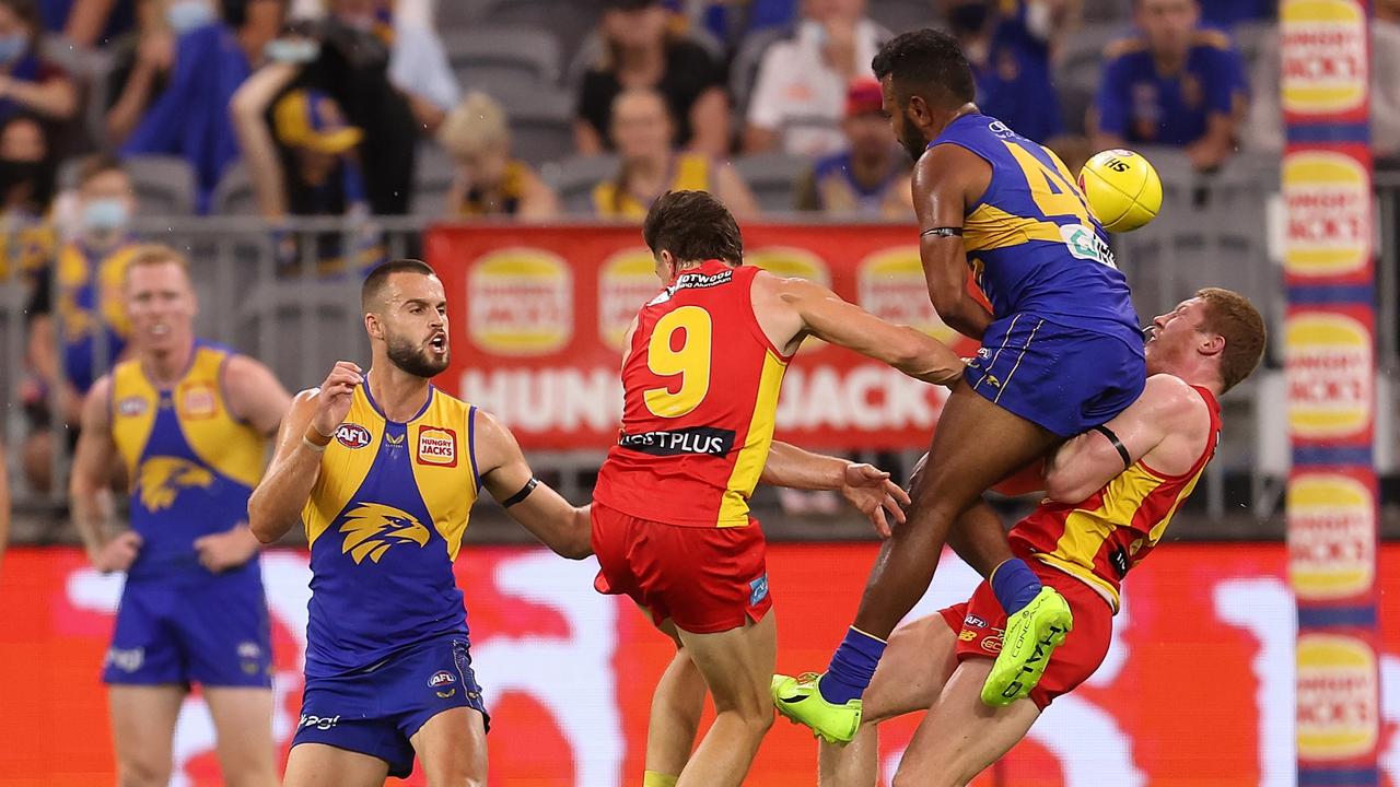PERTH, AUSTRALIA - MARCH 20: Willie Rioli of the Eagles collides with Matt Rowell of the Suns in a marking contest during the round one AFL match between the West Coast Eagles and the Gold Coast Suns at Optus Stadium on March 20, 2022 in Perth, Australia. (Photo by Paul Kane/Getty Images)