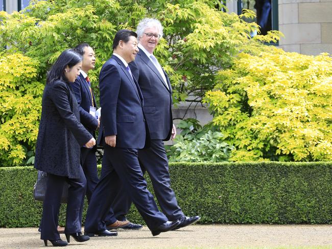 Chinese President Xi Jinping walks with the Lieutenant Governor of Tasmania, Justice Alan Blow, during a visit to Government House in Hobart, Tuesday, November 18, 2014.