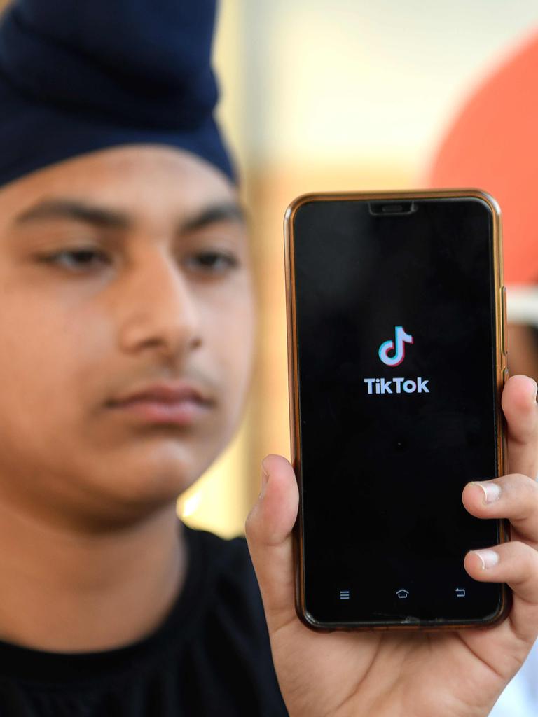 An Indian man shows the TikTok logo on his phone. Picture: Narinder Nanu / AFP