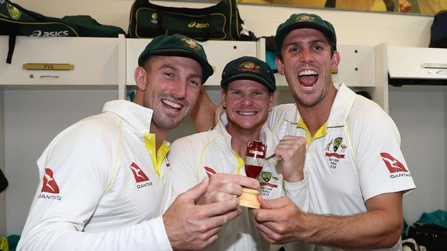 Shaun Marsh, skipper Steve Smith and Mitch Marsh celebrate in the changerooms at the WACA Ground with the Ashes won. Picture: AAP.