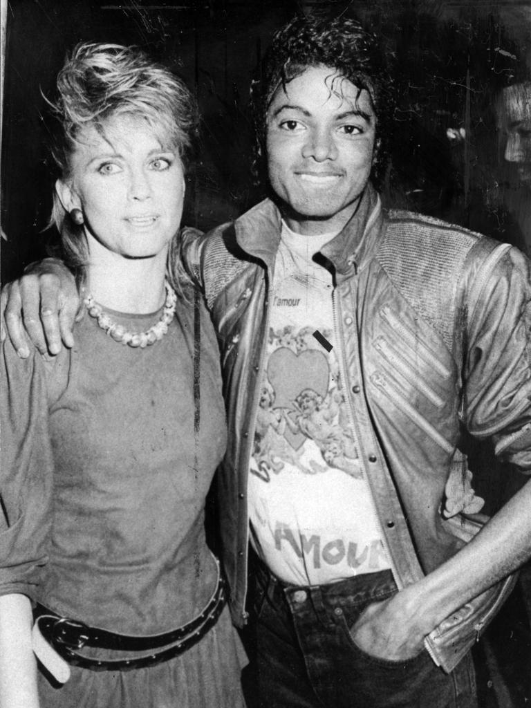 Newton-John with Michael Jackson in Sydney in 1983. Picture: News Limited. .