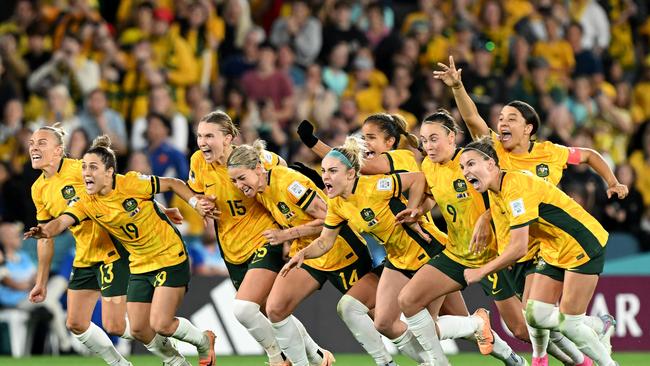 Australia players react after triumphing in the longest penalty shootout in World Cup history. Picture: Getty