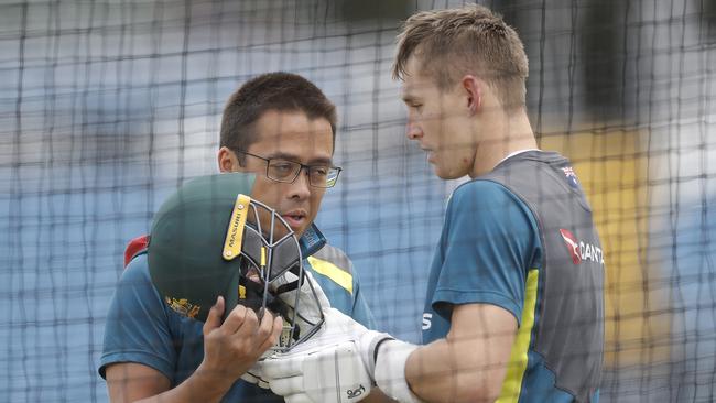 Marnus Labuschagne is assessed by Australian team doctor Richard Saw after being struck in the helmet by a delivery from Mitchell Starc during a nets session at Leeds.