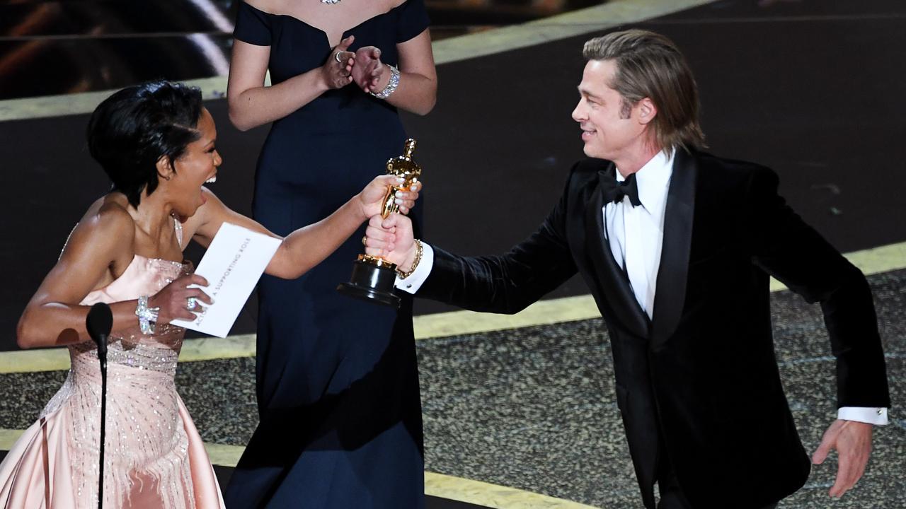 Regina King presents the Best Supporting Actor Oscar to Pitt. Picture: Kevin Winter/Getty Images