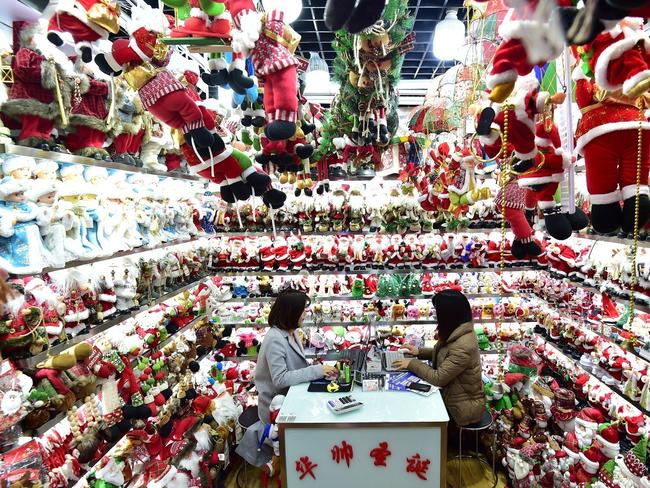 Christmas decorations and gifts are on display at the Yiwu International Trade Market in Yiwu city, Jinhua city, east China's Zhejiang province, 17 December2018. Around 60 percent of the world's Christmas decorations come from factories surrounding Yiwu, in Zhejiang Province, a little more than an hour from Shanghai on the country's high-speed rail. In the Festival Arts subdivision of the Yiwu International Trade Market, every day feels like Christmas. Here, in what is actually only a tiny corner of the world's largest wholesale market for small commodities, aisle after aisle of large cubicles display an array of holiday decorations, from Santa Claus masks to stockings, artificial Christmas trees and metallic-coloured tinsel.  (Imaginechina via AP Images)