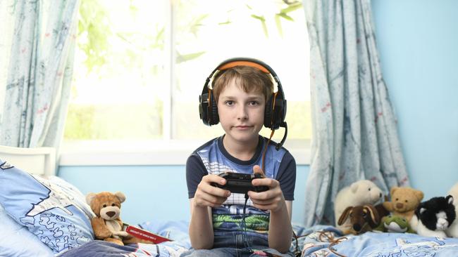 Tom Benhiam, 11, is one of many youngsters obsessed with the Hunger Games-style video game Fortnite: Battle Royale. Picture: Darren Leigh Roberts