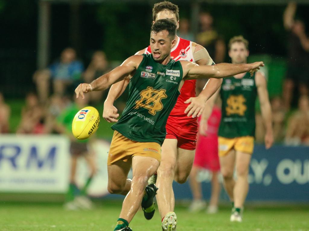 Nathaniel Paredes gets the ball away in the NTFL grand final against Waratah. Picture: Glenn Campbell