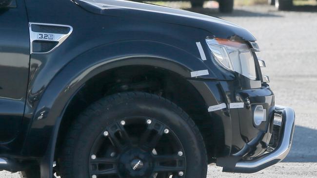 The car which belonged to Joshua Josef Barker in a police impound lot with damage on it's front right bumper bar. Picture: PATRICK GEE