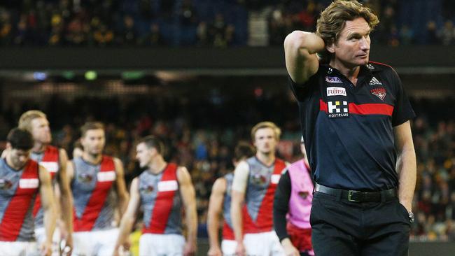 James Hird and team walk off after the loss in 2015. Picture: Colleen Petch