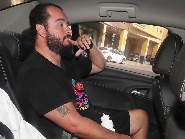 Former Kimberley College principal Paul Thompson's son-in-law Kevin Ferguson being driven into the Brisbane watch house by police. Photographer: Liam Kidston.