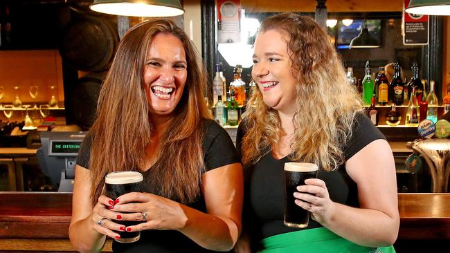 Siobhan D'Costa and Alex McManus enjoy a Guinness without having to be seated at a table on St Patrick’s Day. Picture: Toby Zerna