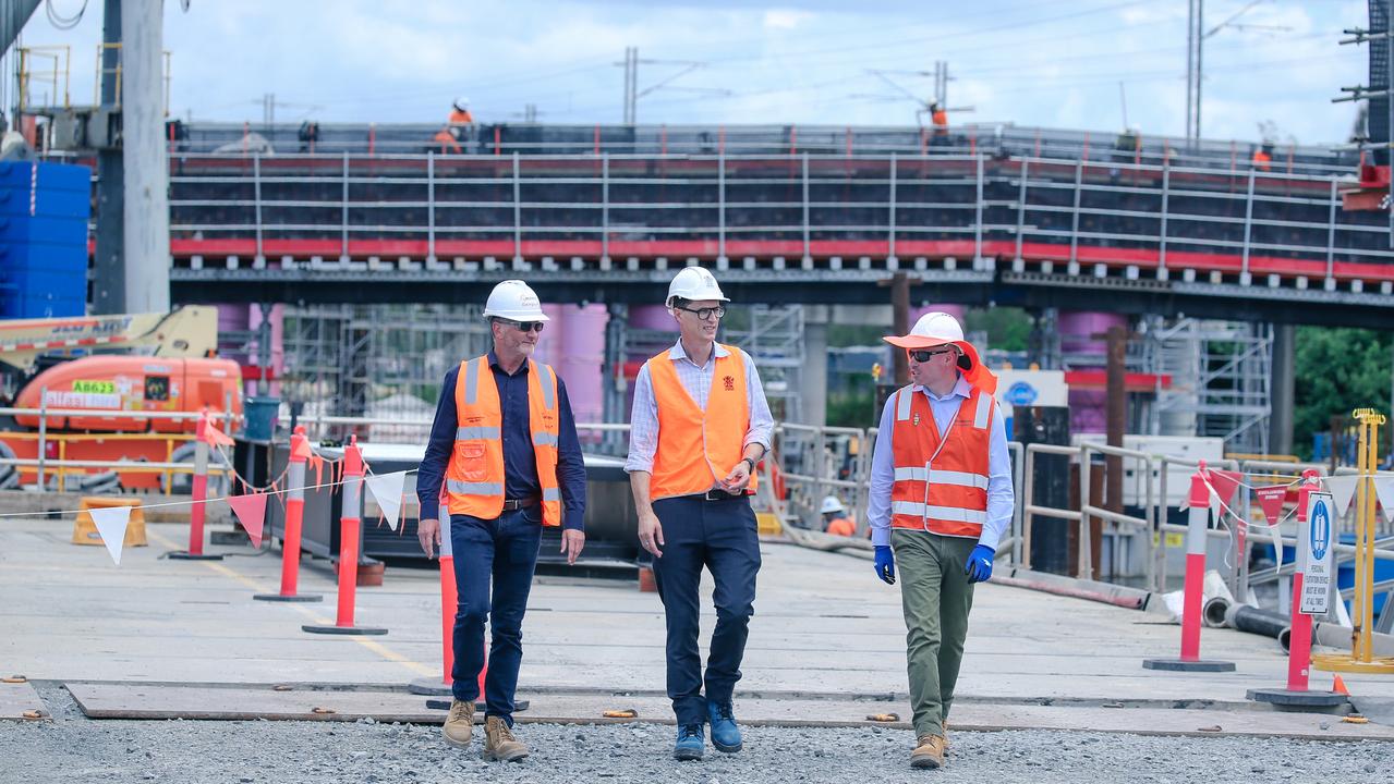 Project Director Darren Wagstaff, Transport and Main Roads Minister Bart Mellish and project manager Andrew Wheeler inspect progress on the Coomera Connector on Tuesday. Picture: Glenn Campbell.