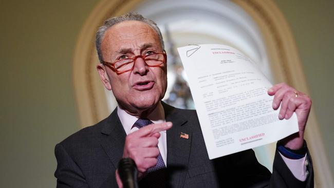 Senate Minority Leader Chuck Schumer speaks to reporters as he holds a transcript of the phone call between US President Donald Trump and Ukraine President Volodymyr Zelensky. Picture: AFP