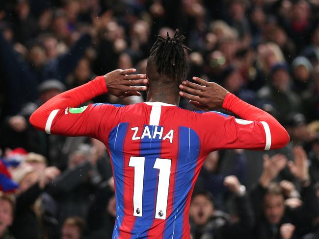 LONDON, ENGLAND - DECEMBER 16: Wilfried Zaha of Crystal Palace celebrates after scoring his sides first goal during the Premier League match between Crystal Palace and Brighton & Hove Albion at Selhurst Park on December 16, 2019 in London, United Kingdom. (Photo by Alex Pantling/Getty Images)