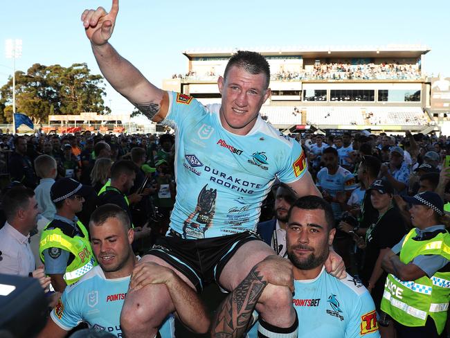 Gallen is chaired off for the last time at Shark Park by Wade Graham and Andrew Fifita. Picture: Brett Costello