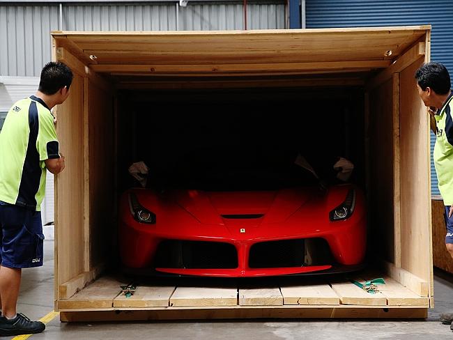 Here it comes ... The La Ferrari is unveiled from its shipping crate at Sydney Motorsport Park, Eastern Creek, for the Ferrari Festival. Picture Craig Greenhill