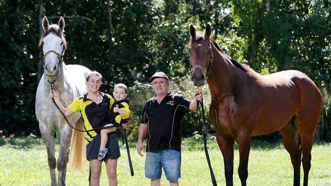 Tiana Bruni and Connor Gittos hold Cleaver Greene, who will race in the Daintree Guineas, and trainer Rodney Miller with City Smart. PICTURE: Brendan Radke