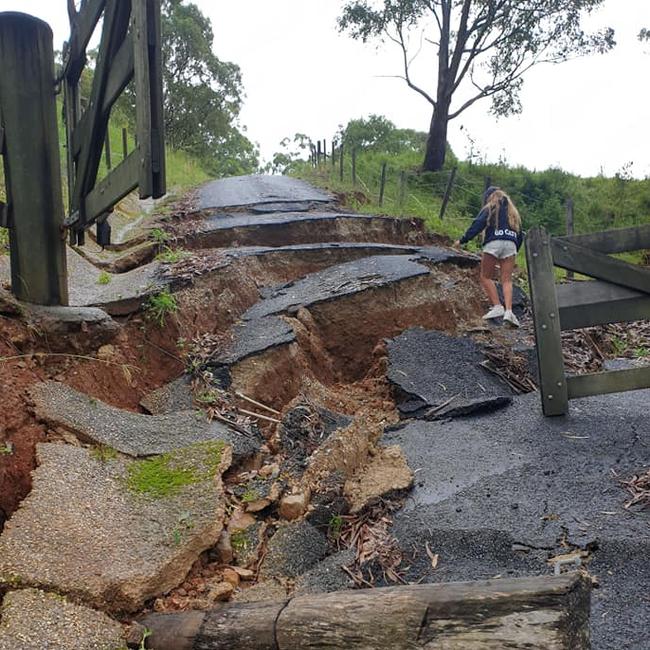 Dave Anderson’s kids climb the driveway at their Neranwood property after a land slip Picture: Supplied