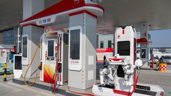 In Suzhou, China, an intelligent robot can refuel cars. Picture: Cfoto/Zuma Press/WSJ