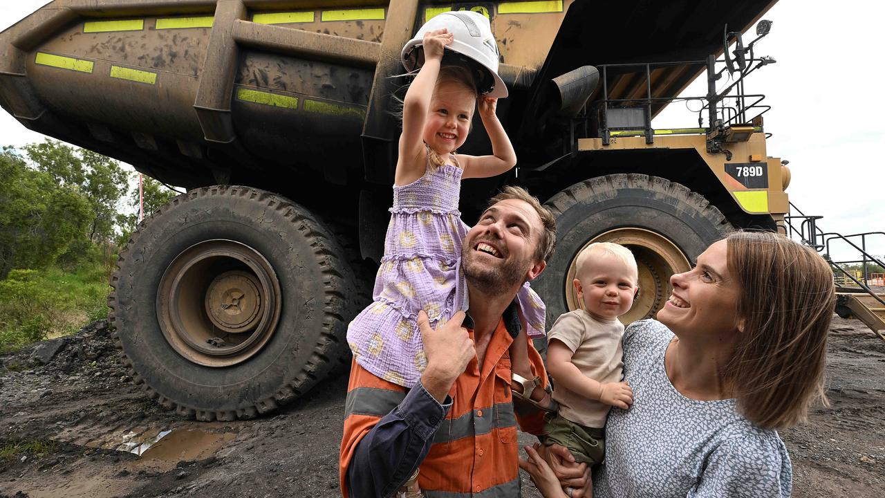 27/10/2022: Newly re hired former New Acland mine worker Bodie Sherrington 33, wife Abby and their children Isla 3 and Monty 1, taking the rare opportunity to show his family some of the huge machinery while the mine is still shut down, ahead of its full reopening in the near future. Bodie is the mines Technical Services Superintendent, who lost his job when the mine closed, and is the first to be re hired back following the mines approval to operate. pic Lyndon Mechielsen