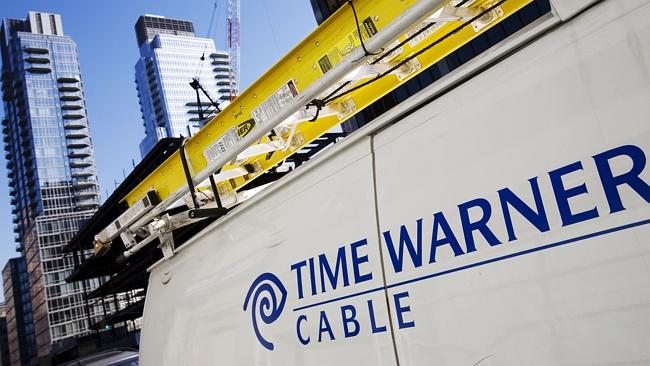 Mega deal ... A Time Warner Cable truck is parked in New York. Comcast has agreed to buy Time Warner Cable for $US45.2 billio...