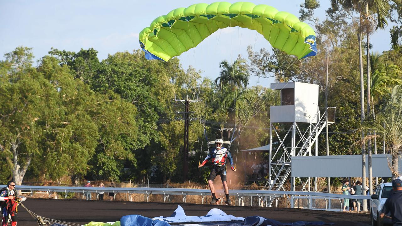 Skydivers deliver the Territory flag and Darwin Cup flag at the Darwin Cup 2022. Picture: (A)manda Parkinson