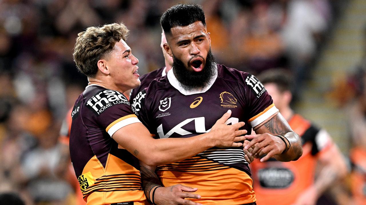 BRISBANE, AUSTRALIA - APRIL 01: Payne Haas of the Broncos celebrates with teammate Reece Walsh of the Broncos after scoring a try during the round five NRL match between Brisbane Broncos and Wests Tigers at Suncorp Stadium on April 01, 2023 in Brisbane, Australia. (Photo by Bradley Kanaris/Getty Images)