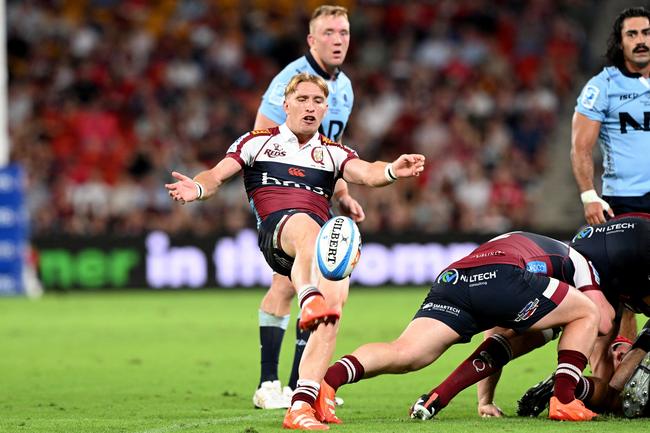 Tate McDermott of the Reds kicks the ball during the round 5Super Rugby Pacific match between the Reds and NSW Waratahs. Photo by Bradley Kanaris