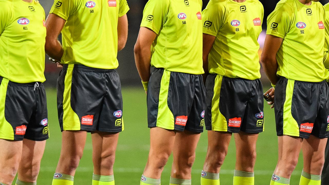 ADELAIDE, AUSTRALIA - APRIL 26: Umpires pause for a minutes silence during the ANZAC observance for during the round 6 AFL match between Port Adelaide and North Melbourne at Adelaide Oval on April 26, 2019 in Adelaide, Australia. (Photo by Daniel Kalisz/Getty Images)