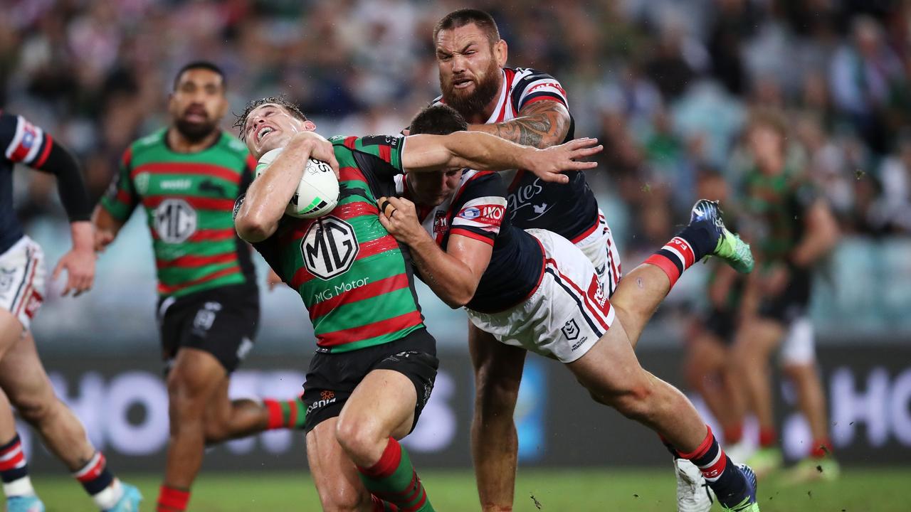 SYDNEY, AUSTRALIA - MARCH 25: Cameron Murray of the Rabbitohs is tackled by Jared Waerea-Hargreaves and Fletcher Baker of the Roosters during the round three NRL match between the South Sydney Rabbitohs and the Sydney Roosters at Accor Stadium, on March 25, 2022, in Sydney, Australia. (Photo by Matt King/Getty Images) *** BESTPIX ***