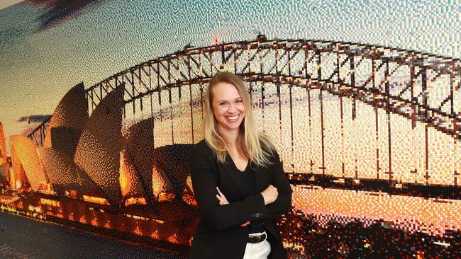 Angie Tutt in front of a Lego brick mosaic at Lego HQ. John Feder/The Australian.