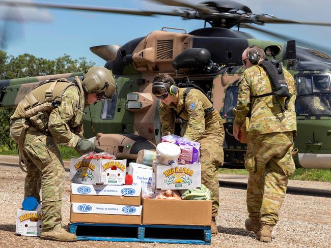 Australian Army soldiers loading crates of fresh food onto a helicopter, ready for delivery to areas of Northern New South Wales affected by Floods. Picture: ADF