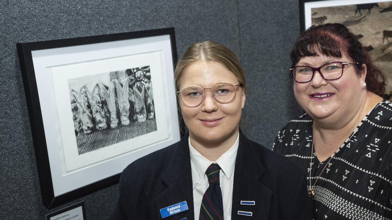 Fairholme College boarder and exhibited artist Kadence Wilson with mum Kimberley Wilson and her work Memories Etched in Leather in the Fairholme Open Art Prize FACETS exhibition, Friday, May 10, 2024. Picture: Kevin Farmer