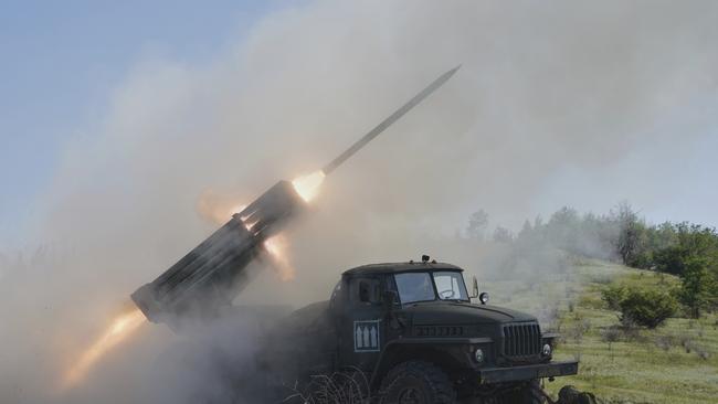 Ukrainian soldiers fire a Grad multiple rocket launcher towards Russian positions at the frontline in Donetsk region on Tuesday. Picture: AP /Andrii Marienko