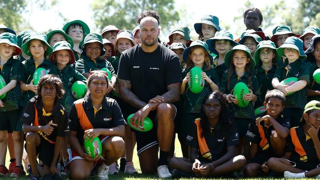 Lance Buddy Franklin poses for a photograph with students from Anula Primary School and the Michael Long Learning and Leadership Centre during an AFL media opportunity at Anula Primary School on May 15, 2024 in Darwin, Australia. (Photo by Michael Willson/AFL Photos)