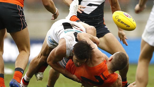 SYDNEY, AUSTRALIA - MARCH 21: Jack Steele of the Saints tackles Jacob Hopper of the Giants during the round one AFL match between the GWS Giants and the St Kilda Saints at GIANTS Stadium on March 21, 2021 in Sydney, Australia. (Photo by Ryan Pierse/Getty Images)