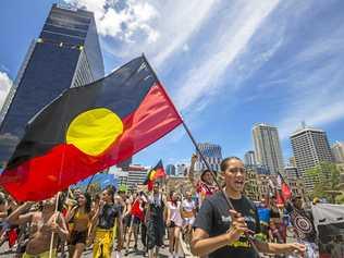 Protesters participate in an Invasion Day march in Brisbane on Australia Day, Friday, January 26, 2018. (AAP Image/Glenn Hunt). Picture: GLENN HUNT