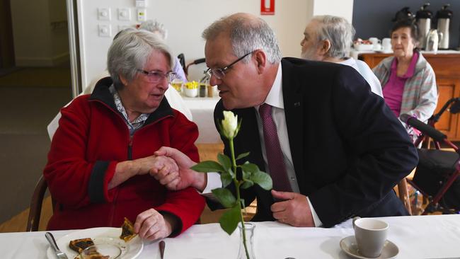 Prime Minister Scott Morrison speaks to a resident during a visit to a Goodwin Retirement Village in Canberra last week.