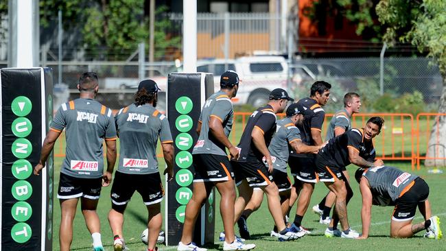 West's Tigers players go in hard during an open training session.