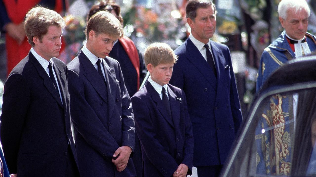 At the funeral of Diana, her brother Earl Spencer, Prince Charles, and sons princes William, 15, and Harry, 12, stand alongside the hearse containing her coffin outside Westminster Abbey. Picture: Jeff Overs