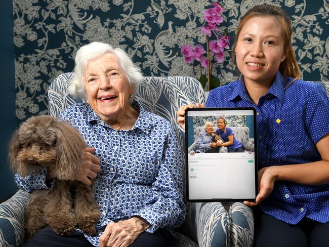 CareApp coronavirus. St Louis Nursing Home resident Alice Bungey 89yrs with Ying Sinthuwanik (Care provider with St Louis Nursing Home) and resident dog Billy who are offering lots of extra love and cuddles to residents through the coronvirus crisis.STORY: Aged care operators are preparing for lockdowns at facilities across the country. Visitation has already reduced, with severe restriction put in place at some facilities. To ease the pain on families, Adelaide-based CareApp is offering free subscription to aged care facilities until June 30. The CareApp app, developed in Adelaide, allows families to remain engaged with their loved ones in aged care facilities by using photos, video and audio as well as notices, events, and newsletters, to create a personalised window into the care and wellbeing of their loved ones. Picture: Tricia Watkinson