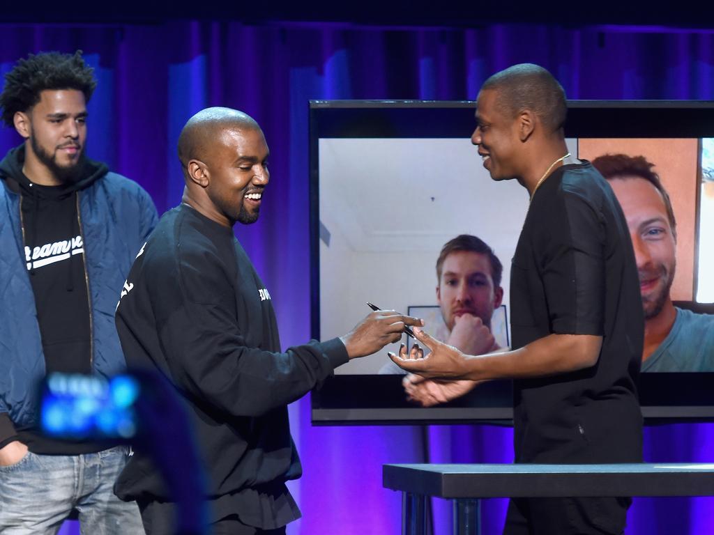 Kanye West and JAY Z (Calvin Harris and Chris Martin) onstage at the Tidal launch event #TIDALforALL at Skylight at Moynihan Station in New York City. Picture: Getty