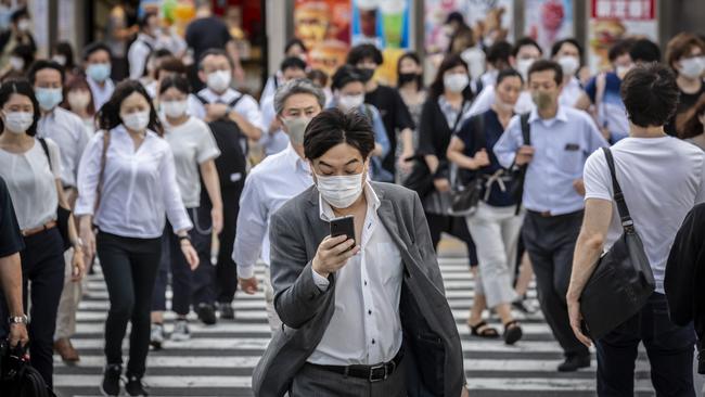 Masked pedestrians in Tokyo, Japan, on Thursday. Picture: Getty Images