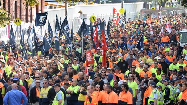  CFMEU Grocon protest March through the city. The crowd marches along Swanston St, with the site of the wall collapse in the ...