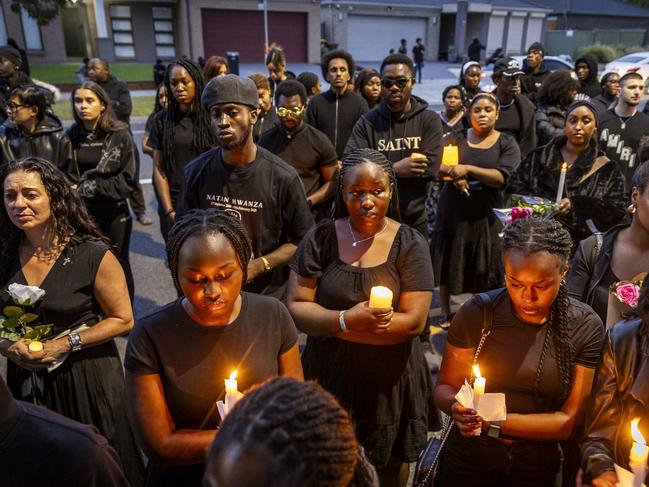 Mourners hold a Candlelight vigil is for stabbing murder victim Nathan Mwanza in Wyndham Vale. Picture: Jake Nowakowski