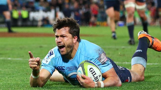 Adam Ashley-Cooper celebrates scoring a try during the Super Rugby Grand Final match between the Waratahs and the Crusaders at ANZ Stadium on August 2, 2014