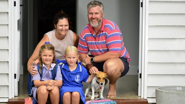 Mia and Lucy McLennan, pictured with mum Chelsea, dad Ross and their dog Leo, will be starting Prep and Year 1 tomorrow. PICTURE: MATT TAYLOR.