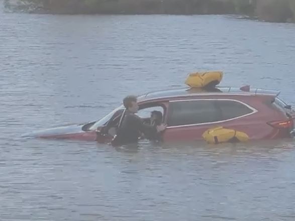 A car has driven straight into a lake in Bendigo this afternoon, with emergency crews led by the SES on scene rescuing those inside. Picture: Gianni Francis